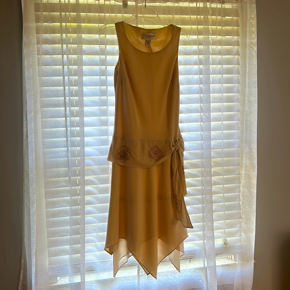 Beautiful dress, light beige with some beading.